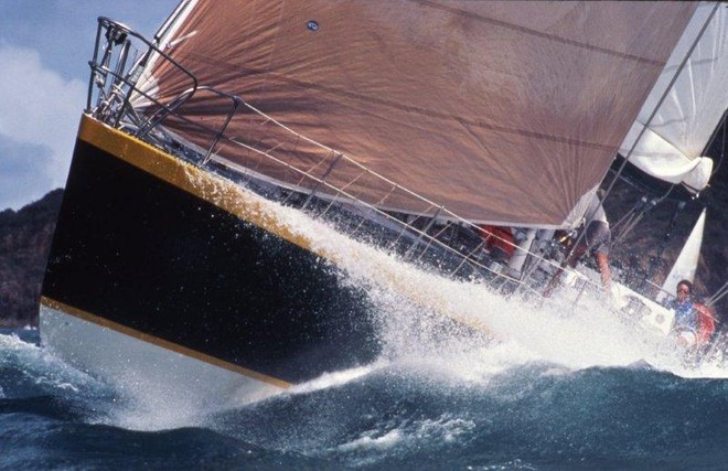 The leaping ‘Gherkin’: Jack Rooklyn’s maxi, Apollo, affectionately known as ‘The Gherkin’, bursts through a wave during the inaugural Hamilton Island Race Week in 1984 © Sandy Peacock